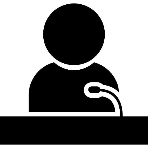 Speaker giving a lecture on a stand speaking speech people icon